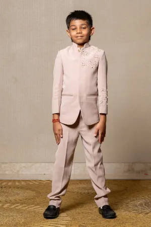 Classy beige suit with delicate floral embroidery and pearl accents, perfect for a sophisticated look at any formal event